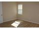 Sunlit bedroom with wood flooring and a neutral color palette at 537 Coral Trace Blvd, Edgewater, FL 32132