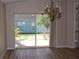 Open dining area showcasing wood floors and a view of the landscaped backyard at 537 Coral Trace Blvd, Edgewater, FL 32132