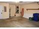 The garage features ample space with a water heater, some overhead storage, and is ready for customization at 537 Coral Trace Blvd, Edgewater, FL 32132