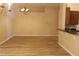 Bright living space features stylish flooring, a modern chandelier, and ample room at 537 Coral Trace Blvd, Edgewater, FL 32132