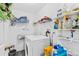 Laundry room with washer, dryer, and shelving at 1331 Umbrella Tree Dr, Edgewater, FL 32132