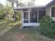 Spacious screened porch with easy access to the backyard at 2325 Date Palm Dr, Edgewater, FL 32141