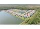 Aerial view of community highlighting home's location near a lake and other homes at 270 Eagle Harbor Way, Daytona Beach, FL 32124