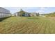 Expansive backyard showcasing lush lawn and partial privacy fence for outdoor enjoyment at 270 Eagle Harbor Way, Daytona Beach, FL 32124