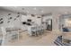 Eat-in kitchen featuring a large island with barstool seating, modern appliances, and an adjacent dining area at 270 Eagle Harbor Way, Daytona Beach, FL 32124