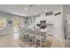 Modern kitchen featuring white cabinetry, a large island with seating, and stainless steel appliances at 270 Eagle Harbor Way, Daytona Beach, FL 32124