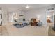 Comfortable living room with neutral decor, a ceiling fan, and an open doorway leading to a bedroom at 270 Eagle Harbor Way, Daytona Beach, FL 32124