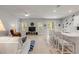 Bright, open living area featuring comfortable seating, large windows, and access to the kitchen and outdoor space at 270 Eagle Harbor Way, Daytona Beach, FL 32124