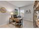 Well-lit office featuring a wooden desk, neutral walls, and a window with blinds for natural light at 270 Eagle Harbor Way, Daytona Beach, FL 32124
