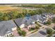 Aerial view of the townhome with lake and greenbelt views at 3331 Torre Blvd, New Smyrna Beach, FL 32168