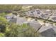 Expansive aerial view of the neighborhood showcasing lush landscaping and rooftops at 3331 Torre Blvd, New Smyrna Beach, FL 32168