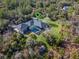 Aerial view showing home's location and surrounding nature at 335 Woodridge Dr, Geneva, FL 32732