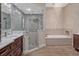 Bathroom features a walk-in shower, soaking tub, and chandelier at 335 Woodridge Dr, Geneva, FL 32732