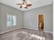 Serene bedroom includes ceiling fan, window shutters, and en-suite bathroom access at 335 Woodridge Dr, Geneva, FL 32732