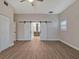 Primary bedroom with barn doors to en-suite bathroom at 335 Woodridge Dr, Geneva, FL 32732