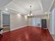 Elegant dining room featuring hardwood floors, a chandelier, and access to other rooms at 335 Woodridge Dr, Geneva, FL 32732