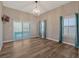 Bright dining room features wood-look floors and sliding glass doors leading to outdoor space at 335 Woodridge Dr, Geneva, FL 32732