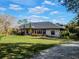 Spacious home with stone exterior, and large lawn at 335 Woodridge Dr, Geneva, FL 32732