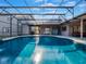 Inviting screened pool with a covered patio at 335 Woodridge Dr, Geneva, FL 32732