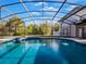 Refreshing pool with a screened enclosure and spa at 335 Woodridge Dr, Geneva, FL 32732