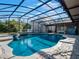 Sparkling screened pool with a large patio area at 335 Woodridge Dr, Geneva, FL 32732