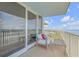 Balcony with ocean view and comfortable seating at 5203 S Atlantic Ave # 814B, New Smyrna Beach, FL 32169