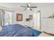 Primary bedroom with dresser, TV, and ocean view at 5203 S Atlantic Ave # 814B, New Smyrna Beach, FL 32169