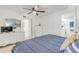 Bedroom with dresser, TV, and bathroom access at 5203 S Atlantic Ave # 814B, New Smyrna Beach, FL 32169