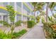 Exterior walkway with tropical landscaping at 5203 S Atlantic Ave # 814B, New Smyrna Beach, FL 32169