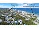 Aerial view highlighting beach access and house location at 915 Maple St, New Smyrna Beach, FL 32169