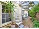 Spiral staircase leads to backyard oasis with lush landscaping at 915 Maple St, New Smyrna Beach, FL 32169