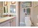 Bathroom with double sinks, toilet and shower at 915 Maple St, New Smyrna Beach, FL 32169