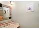 Charming bathroom with unique mirror and seashell decor at 915 Maple St, New Smyrna Beach, FL 32169