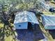 An aerial view of a detached garage with a metal roof at 977 Bay Dr, New Smyrna Beach, FL 32168