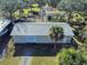 Aerial view of a large metal garage/workshop on a grassy lot at 977 Bay Dr, New Smyrna Beach, FL 32168