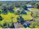 Single story home with metal roof and surrounding landscape at 977 Bay Dr, New Smyrna Beach, FL 32168