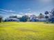 Aerial view of a house and large workshop on a spacious lot at 977 Bay Dr, New Smyrna Beach, FL 32168