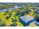 Single-story home on a waterfront lot with lush vegetation at 977 Bay Dr, New Smyrna Beach, FL 32168