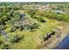 Aerial view of waterfront property with expansive green space at 977 Bay Dr, New Smyrna Beach, FL 32168