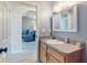 Well-appointed bathroom with a single sink vanity and access to another room at 977 Bay Dr, New Smyrna Beach, FL 32168