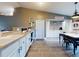 Farmhouse style kitchen with white cabinets and breakfast nook at 977 Bay Dr, New Smyrna Beach, FL 32168