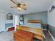 Spacious main bedroom featuring a ceiling fan and wood flooring at 977 Bay Dr, New Smyrna Beach, FL 32168