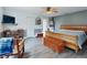 Main bedroom with wood sleigh bed and ceiling fan at 977 Bay Dr, New Smyrna Beach, FL 32168