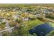 Aerial view of the neighborhood and surrounding area with a lake at 1052 Tompkins Dr, Port Orange, FL 32129