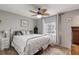 Cozy bedroom with neutral tones, white metal bedframe, and a window with natural light at 1052 Tompkins Dr, Port Orange, FL 32129