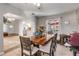 Inviting dining room with wooden table and chairs, view of kitchen, and ample natural light at 1052 Tompkins Dr, Port Orange, FL 32129