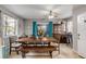 Open dining area with large wooden table, modern furnishings, and bright window at 1052 Tompkins Dr, Port Orange, FL 32129