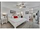 Bright bedroom with a large bed, mirrored closet, and modern furnishings, offering comfort and style at 116 Cedar Dunes Dr, New Smyrna Beach, FL 32169