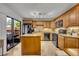 Modern kitchen boasting granite countertops, stainless steel appliances, and a breakfast bar at 116 Cedar Dunes Dr, New Smyrna Beach, FL 32169