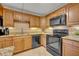Well-equipped kitchen with stainless steel appliances, granite countertops, and ample cabinet space at 116 Cedar Dunes Dr, New Smyrna Beach, FL 32169